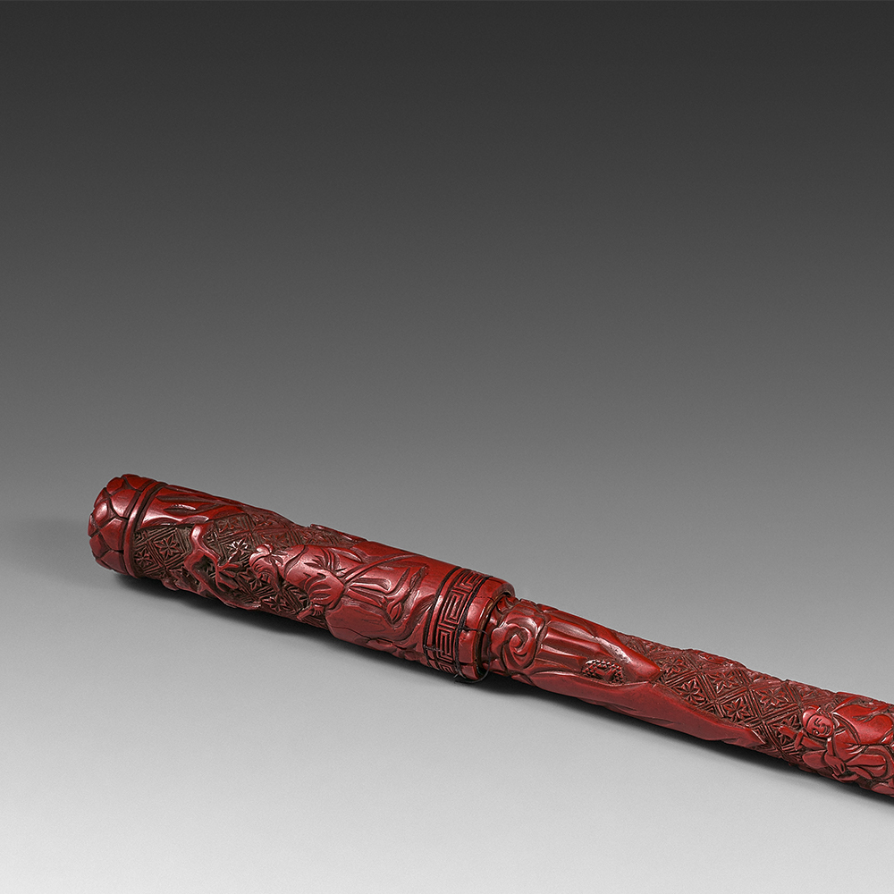 A carved red lacquer brush and cover depicting characters in a rocky landscape - 2